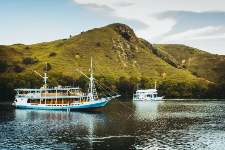 Luxury yacht sailing from Bali to Komodo Island across clear tropical waters