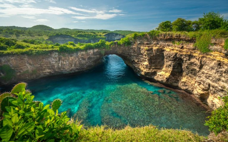 Broken Beach’s unique rock arch and coastal cliffs, seen during a Nusa Penida island boat trip